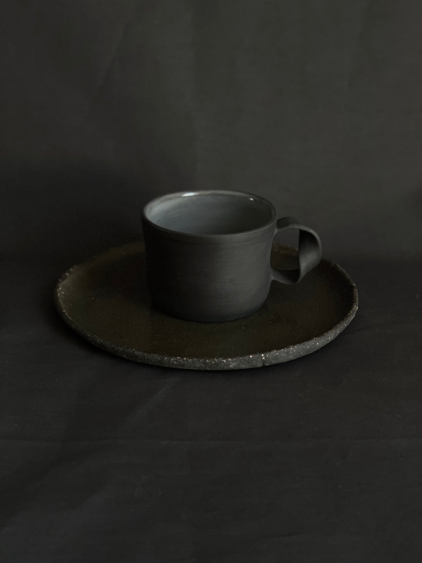 Black porcelain twisted handle cup