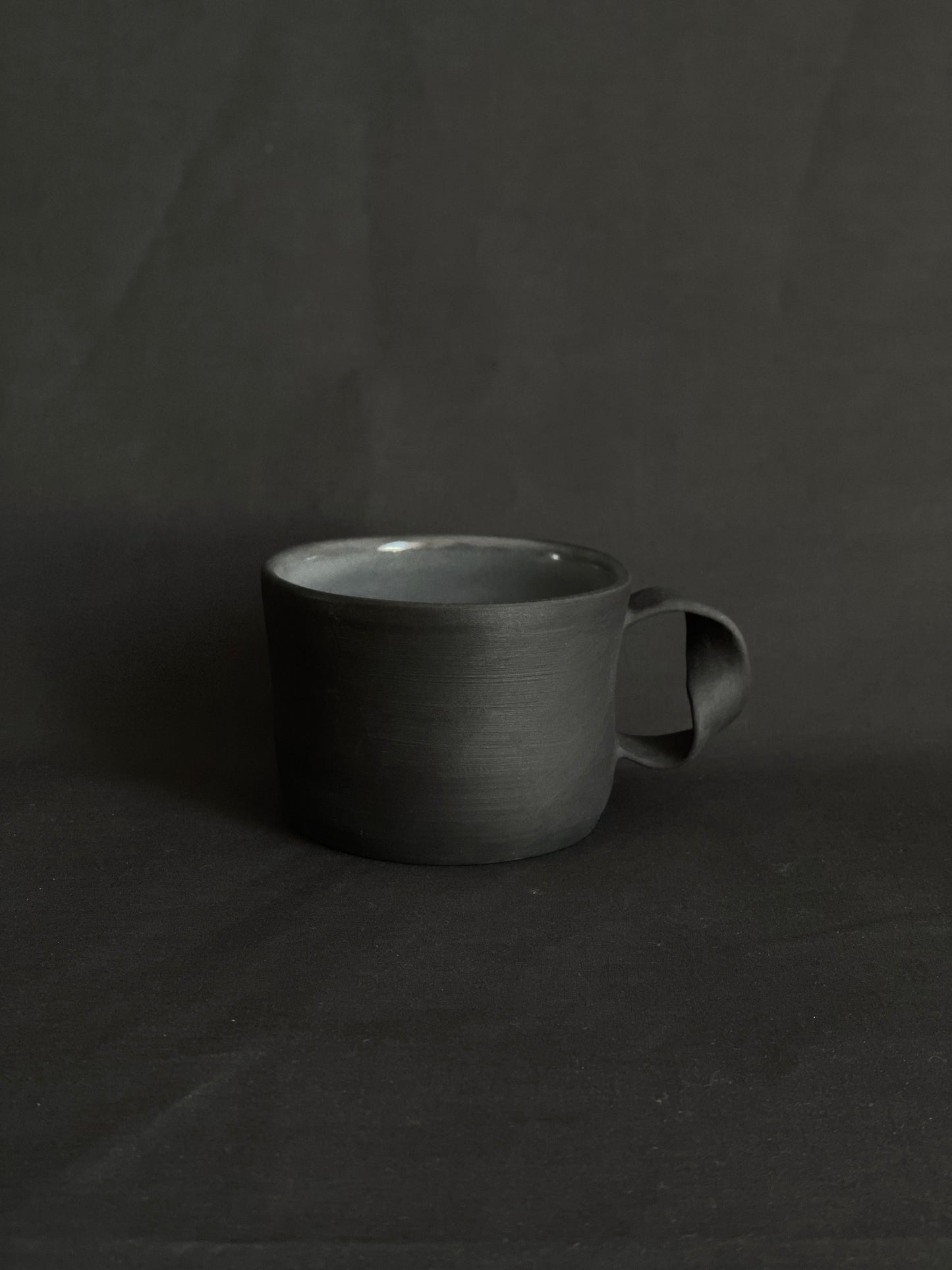 Black porcelain twisted handle cup