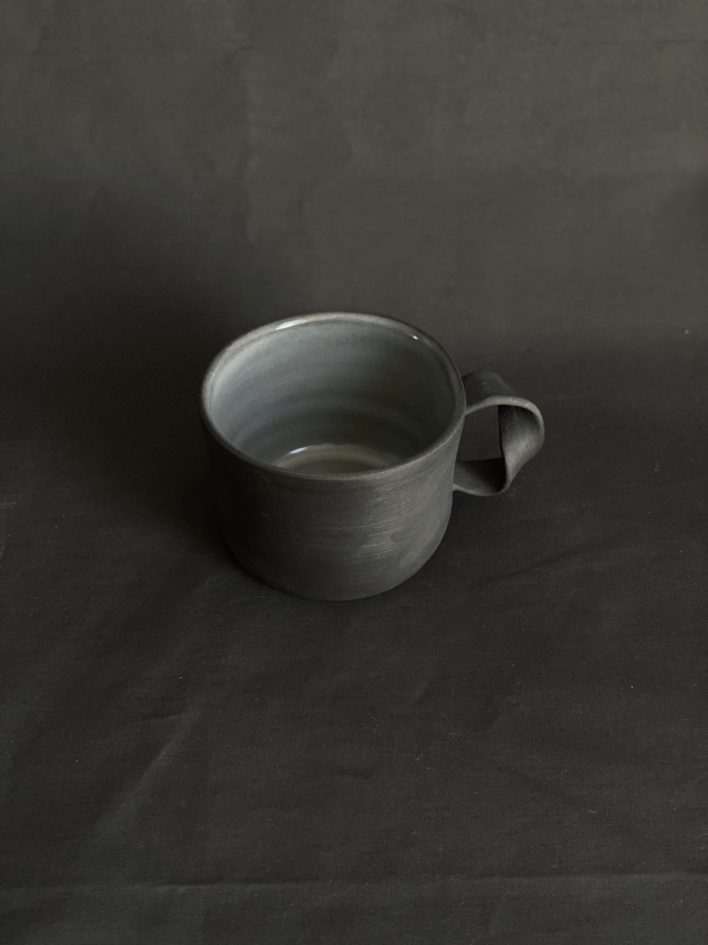 Black porcelain twisted handle cup