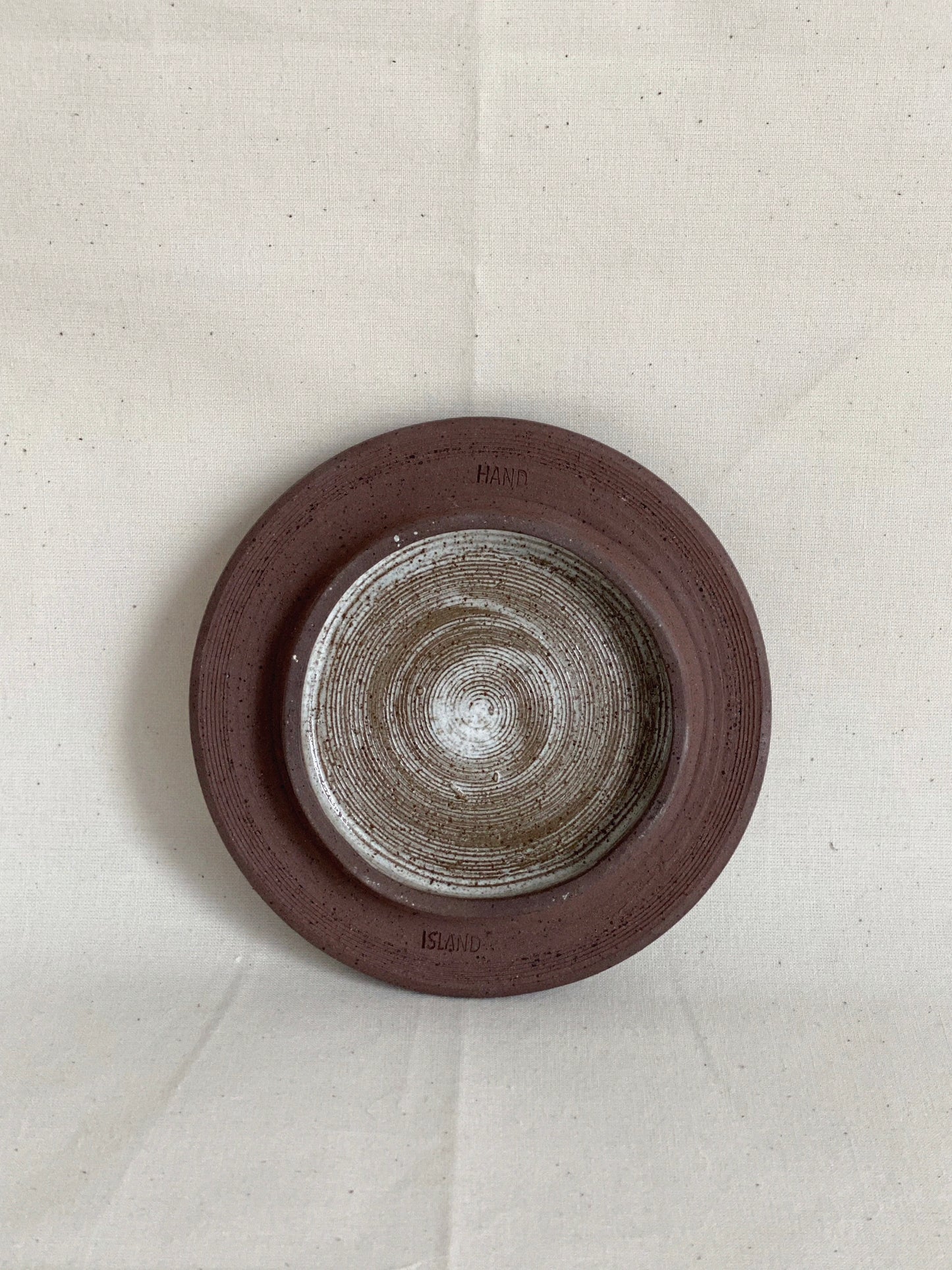 Wabi-sabi footed snow speckled plate